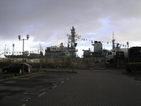 HMS Westminster casting a dark shadow over the car park of the new Senedd